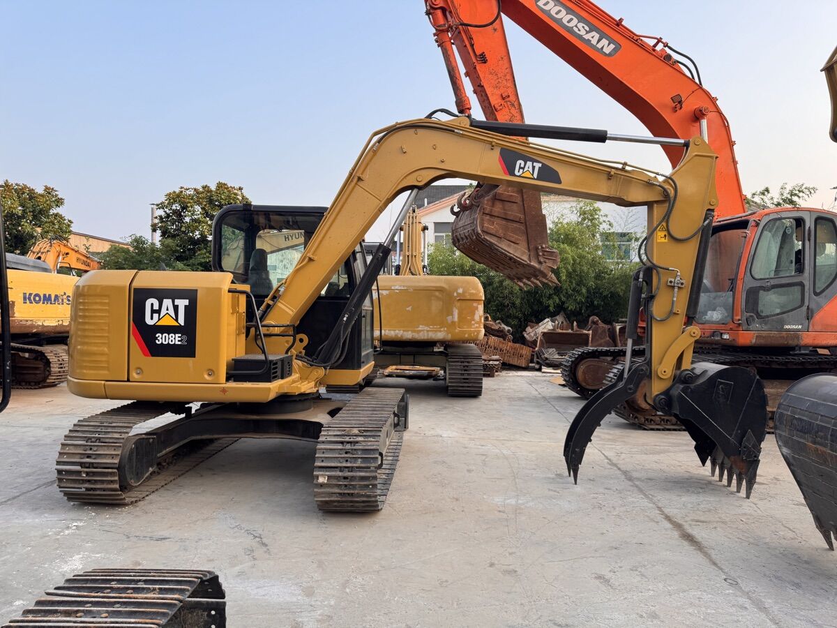 CAT 308 mini excavator at the sourcing facility — refurbished and ready for export
