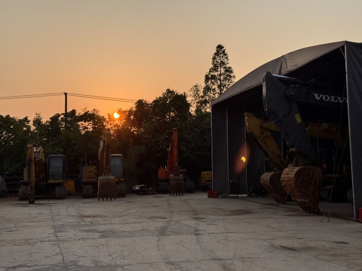 Golden hour at the facility — rows of equipment in warm light
