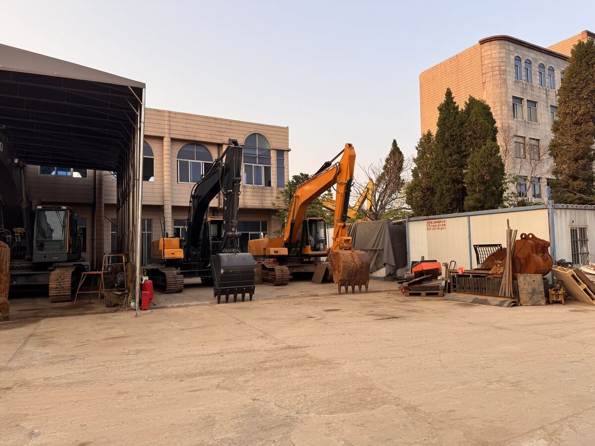 Covered maintenance area with bulldozer and CAT excavators